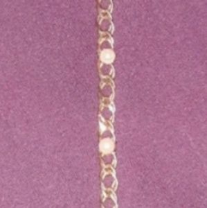 Gold and pearl bracelet figaro link